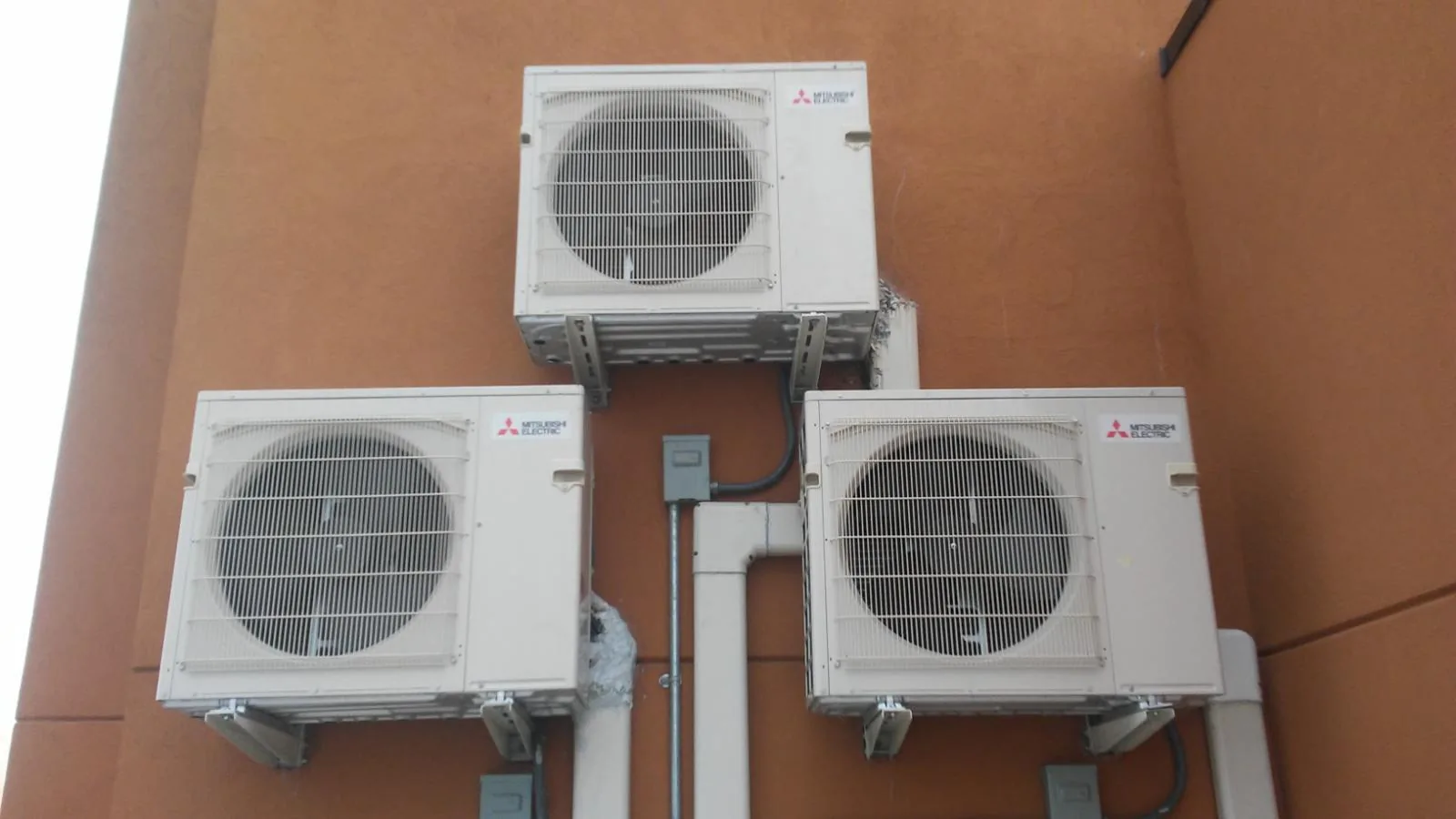 Three Mitsubishi condensers wall-mounted on a New York building by JJR Mechanical