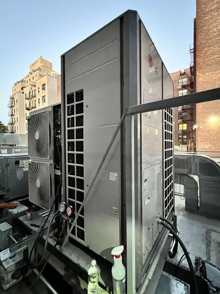 Gauges connected to a rooftop VRF condensing unit during refrigerant diagnostics in New York City