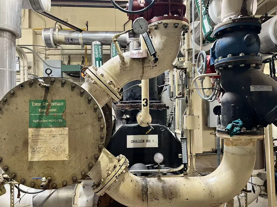 Chiller condenser head removed for tube cleaning during NYC chiller service