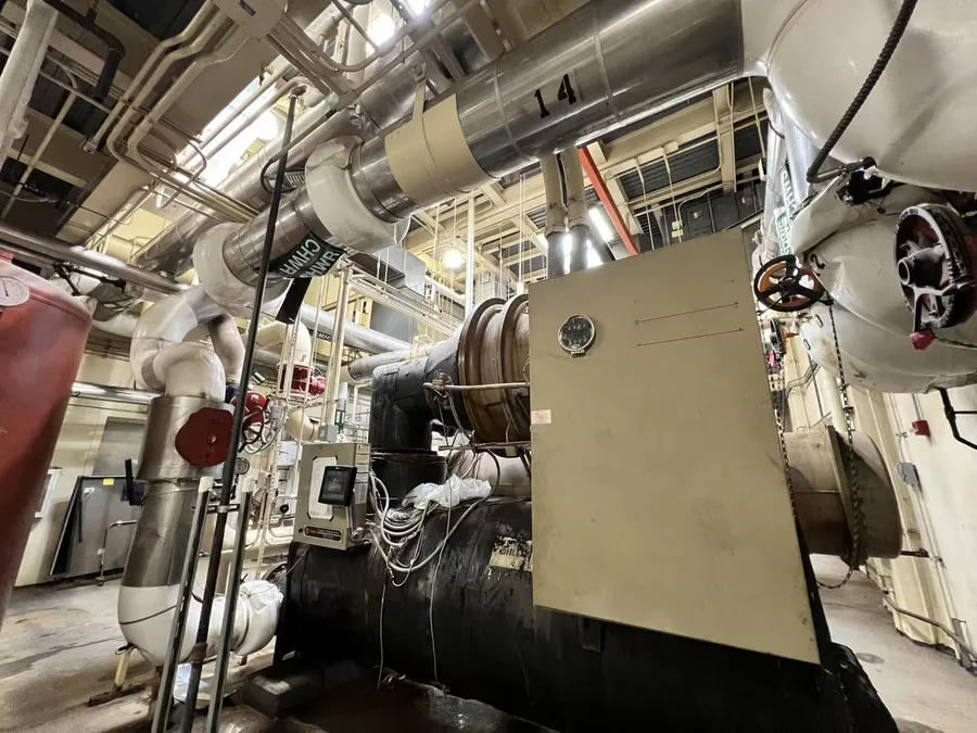 Commercial chiller plant room in New York City with centrifugal chillers and chilled water piping