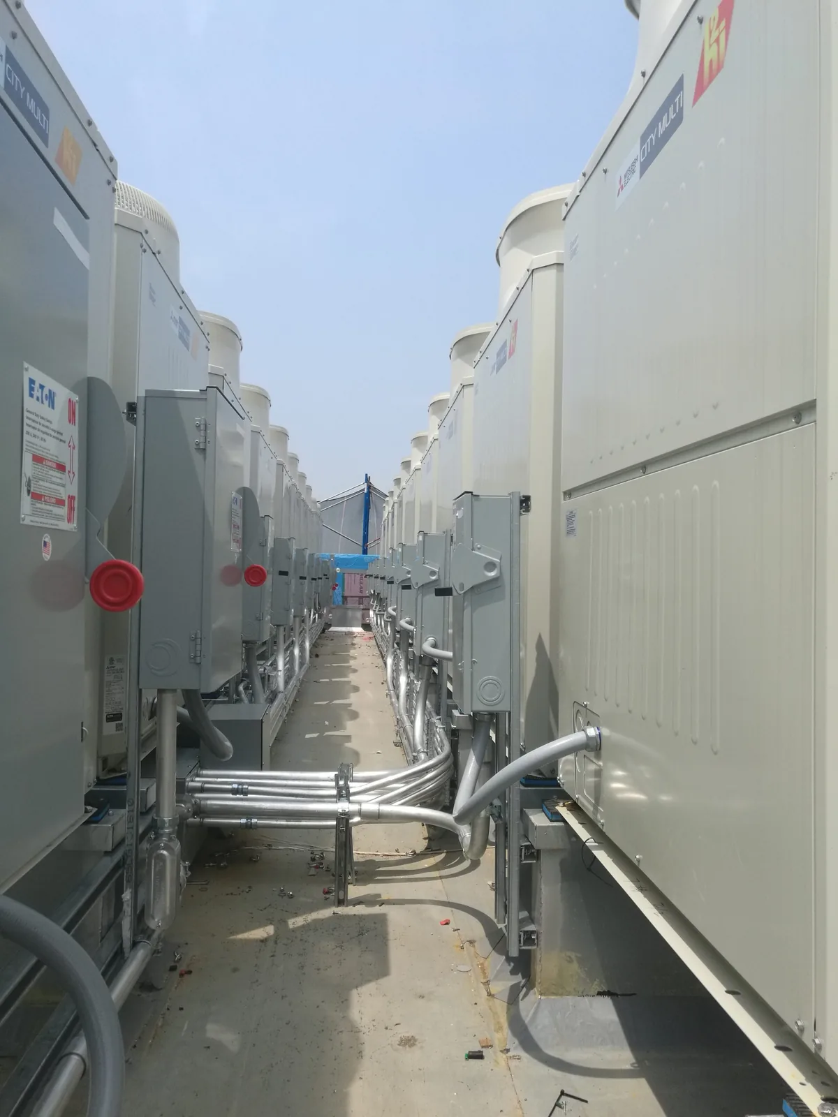Row of large rooftop HVAC units installed by JJR Mechanical in New York